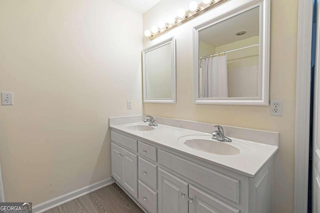 32 N Muscogee Dr, Ellijay, GA 30540 - bathroom with double vanity and wood finished floors