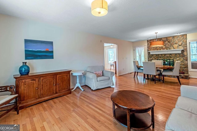 32 N Muscogee Dr, Ellijay, GA 30540 - living room featuring light wood-style floors and a fireplace