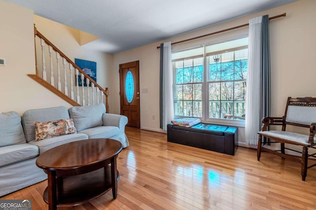 32 N Muscogee Dr, Ellijay, GA 30540 - living area featuring stairs and light wood-style floors