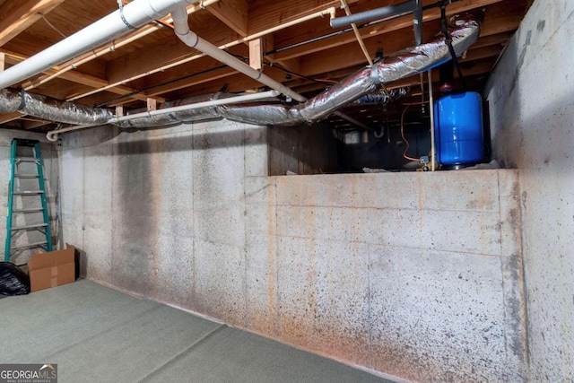 32 N Muscogee Dr, Ellijay, GA 30540 - unfinished below grade area with a water pressure tank
