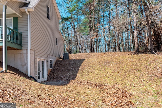 32 N Muscogee Dr, Ellijay, GA 30540 - view of home's exterior featuring french doors and a shingled roof