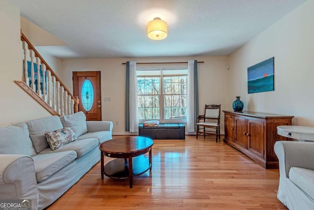 32 N Muscogee Dr, Ellijay, GA 30540 - living area featuring light wood-style flooring and stairs