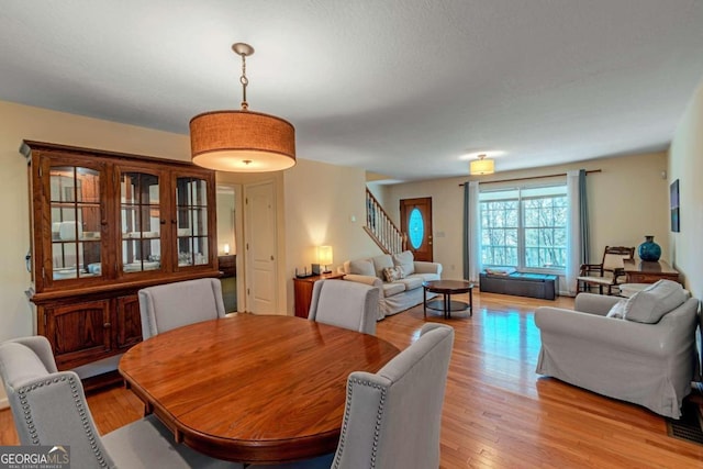 32 N Muscogee Dr, Ellijay, GA 30540 - dining room featuring stairs and light wood finished floors