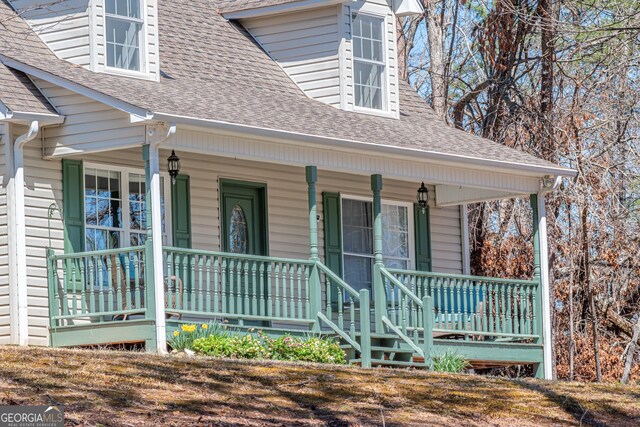 32 N Muscogee Dr, Ellijay, GA 30540 - view of exterior entry with a porch and a shingled roof