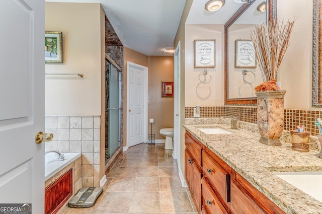 4441 Manning Mill Rd, Summerville, GA 30747 - full bath with double vanity, a stall shower, a garden tub, toilet, and baseboards