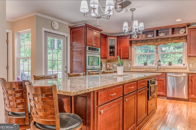 4441 Manning Mill Rd, Summerville, GA 30747 - kitchen featuring stainless steel appliances, a chandelier, decorative backsplash, light stone counters, and hanging light fixtures
