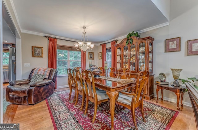 4441 Manning Mill Rd, Summerville, GA 30747 - dining space featuring a chandelier, ornamental molding, light wood-type flooring, and baseboards