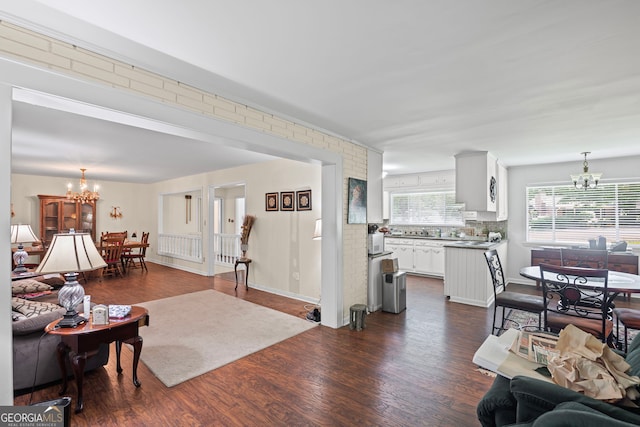 24 Brookside Dr, Newnan, GA 30263 - living room featuring a chandelier and dark wood-type flooring