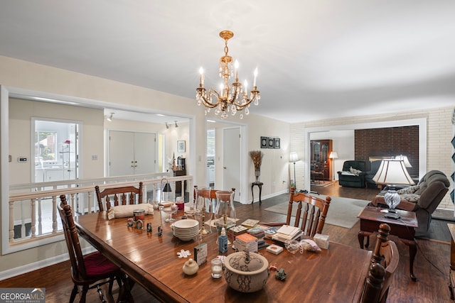 24 Brookside Dr, Newnan, GA 30263 - dining area featuring baseboards, a chandelier, wood finished floors, and plenty of natural light
