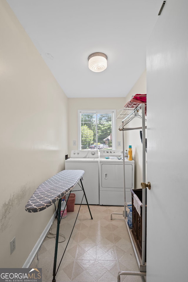 24 Brookside Dr, Newnan, GA 30263 - washroom featuring separate washer and dryer, light flooring, and baseboards