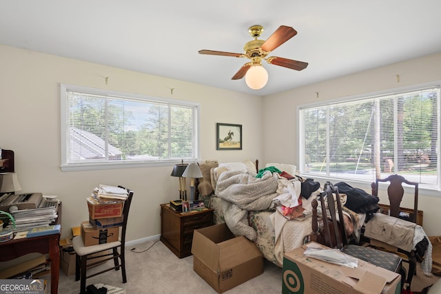 24 Brookside Dr, Newnan, GA 30263 - bedroom with multiple windows, light colored carpet, baseboards, and ceiling fan