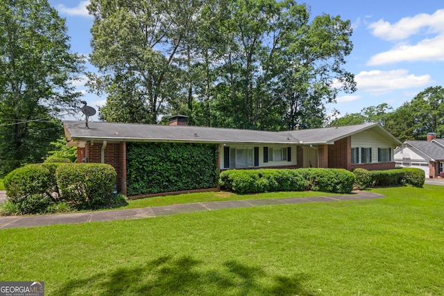 24 Brookside Dr, Newnan, GA 30263 - view of front facade with brick siding, a front yard, and a chimney