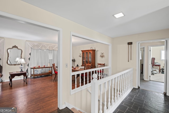 24 Brookside Dr, Newnan, GA 30263 - corridor with an upstairs landing, baseboards, and dark wood finished floors