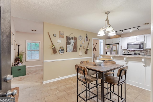160 W Fork Dr, Newnan, GA 30263 - bedroom featuring carpet, a textured ceiling, and a ceiling fan