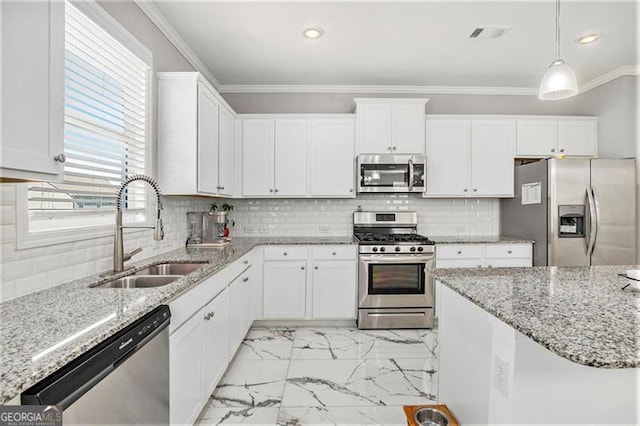 413 Huntleigh Shores Ln, Dallas, GA 30132 - kitchen featuring appliances with stainless steel finishes, light marble finish floors, ornamental molding, white cabinets, and recessed lighting