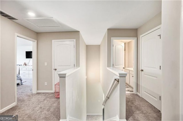 413 Huntleigh Shores Ln, Dallas, GA 30132 - corridor with an upstairs landing and light carpet