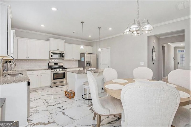 413 Huntleigh Shores Ln, Dallas, GA 30132 - dining space with recessed lighting, ornamental molding, a chandelier, and light marble finish floors