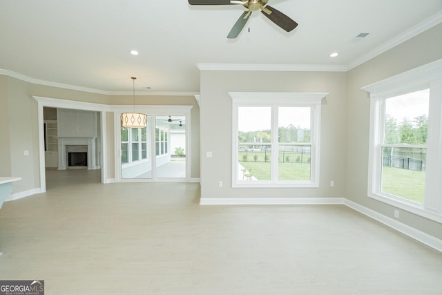 215 Jake Colton Dr, Kingsland, GA 31548 - unfurnished living room featuring a ceiling fan, light wood-style floors, healthy amount of natural light, ornamental molding, and recessed lighting