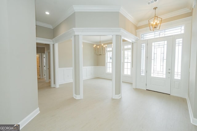 215 Jake Colton Dr, Kingsland, GA 31548 - foyer entrance featuring a chandelier, plenty of natural light, ornamental molding, recessed lighting, and light wood finished floors