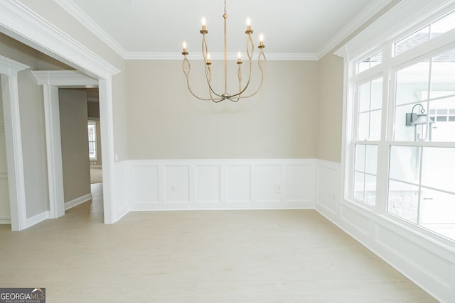 215 Jake Colton Dr, Kingsland, GA 31548 - empty room with a chandelier, ornamental molding, light wood-type flooring, and a wainscoted wall