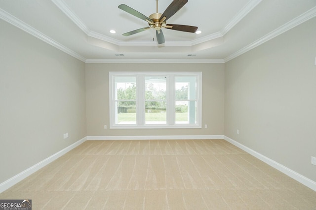 215 Jake Colton Dr, Kingsland, GA 31548 - spare room featuring a raised ceiling, light carpet, crown molding, baseboards, and recessed lighting