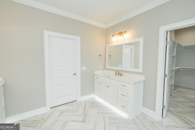 215 Jake Colton Dr, Kingsland, GA 31548 - bathroom featuring vanity, crown molding, a spacious closet, and baseboards