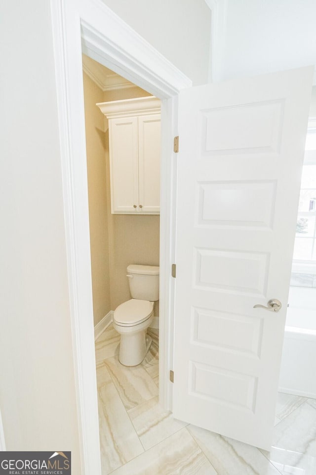 215 Jake Colton Dr, Kingsland, GA 31548 - full bath with toilet, marble finish floors, ornamental molding, baseboards, and a bath