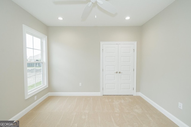 215 Jake Colton Dr, Kingsland, GA 31548 - unfurnished bedroom featuring light colored carpet, a closet, baseboards, recessed lighting, and a ceiling fan