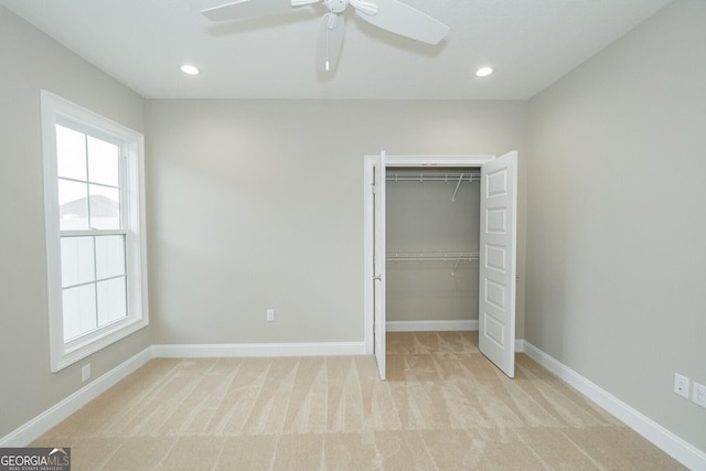215 Jake Colton Dr, Kingsland, GA 31548 - unfurnished bedroom with light carpet, a closet, baseboards, recessed lighting, and ceiling fan