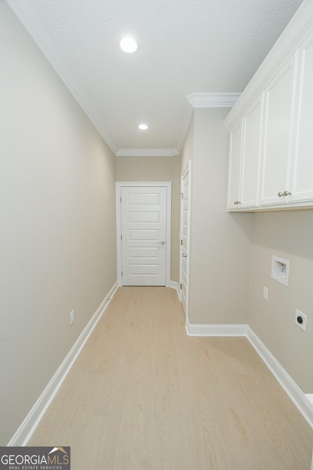 215 Jake Colton Dr, Kingsland, GA 31548 - laundry area with hookup for an electric dryer, washer hookup, light wood finished floors, ornamental molding, and cabinet space