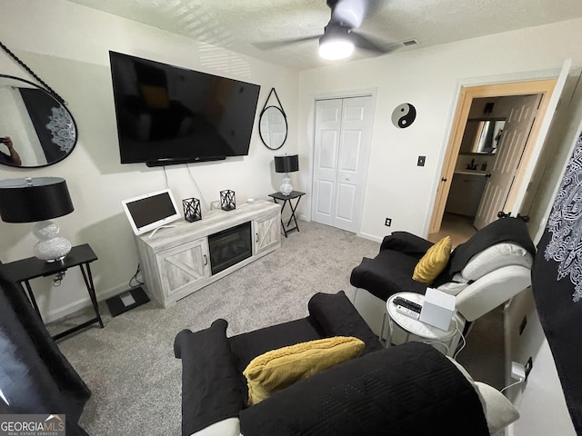401 Bainbridge Dr, Mcdonough, GA 30253 - living area with carpet floors, baseboards, a ceiling fan, and a textured ceiling