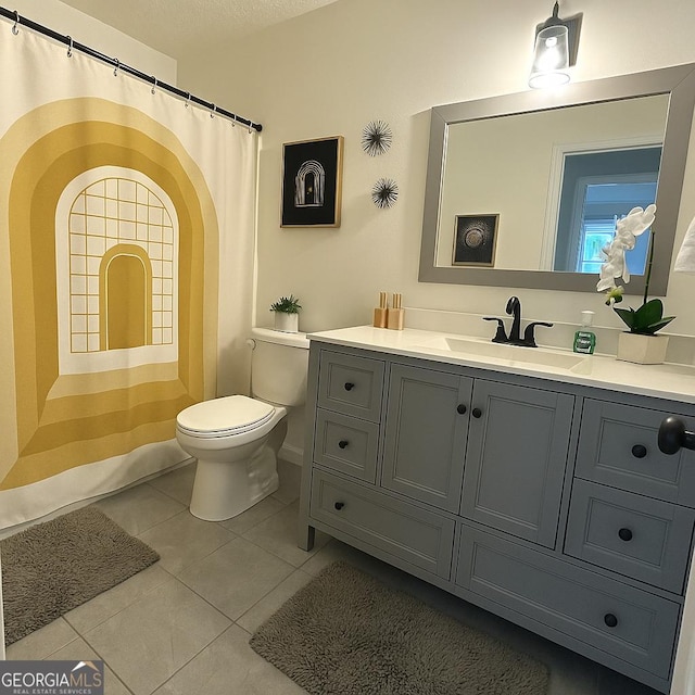 401 Bainbridge Dr, Mcdonough, GA 30253 - full bath with toilet, vanity, tile patterned floors, a shower with curtain, and a textured ceiling