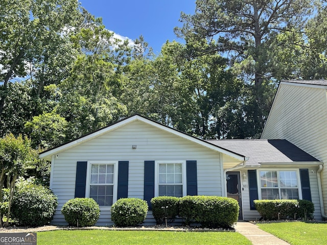 401 Bainbridge Dr, Mcdonough, GA 30253 - view of front of home featuring a front lawn and roof with shingles