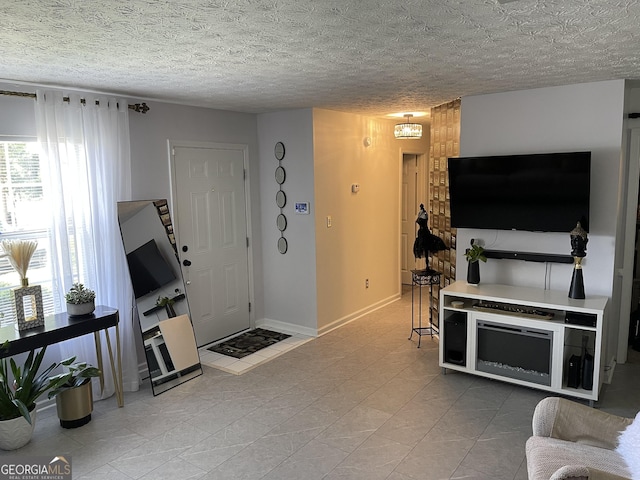 401 Bainbridge Dr, Mcdonough, GA 30253 - living room featuring baseboards and a textured ceiling