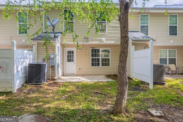 1851 Grove Way, Hampton, GA 30228 - rear view of house with a patio area