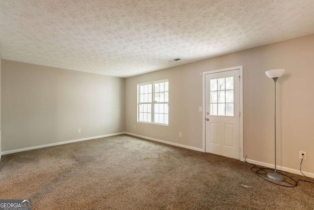 1851 Grove Way, Hampton, GA 30228 - entryway featuring carpet floors and a textured ceiling