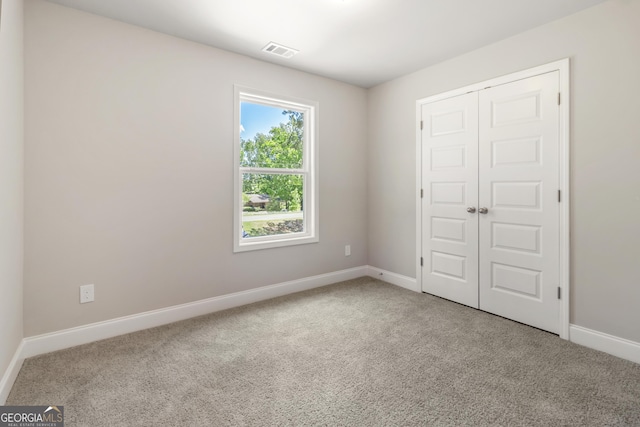 68 Davis Lake Rd Lot 16, Thomaston, GA 30286 - unfurnished bedroom with carpet floors, a closet, and baseboards