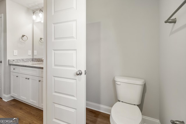 68 Davis Lake Rd Lot 16, Thomaston, GA 30286 - half bathroom featuring toilet, vanity, wood finished floors, and baseboards