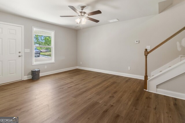 68 Davis Lake Rd Lot 16, Thomaston, GA 30286 - unfurnished living room featuring wood finished floors, ceiling fan, stairs, and baseboards