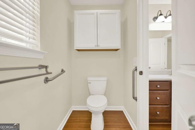 405 Scenic View Dr, Jasper, GA 30143 - bathroom with toilet, vanity, wood finished floors, and baseboards