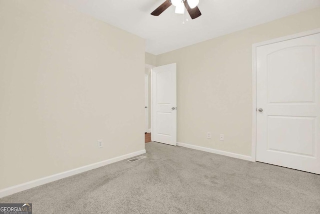 405 Scenic View Dr, Jasper, GA 30143 - unfurnished bedroom with carpet floors, baseboards, and a ceiling fan