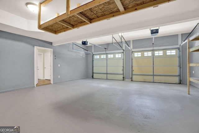 405 Scenic View Dr, Jasper, GA 30143 - garage featuring a garage door opener and baseboards