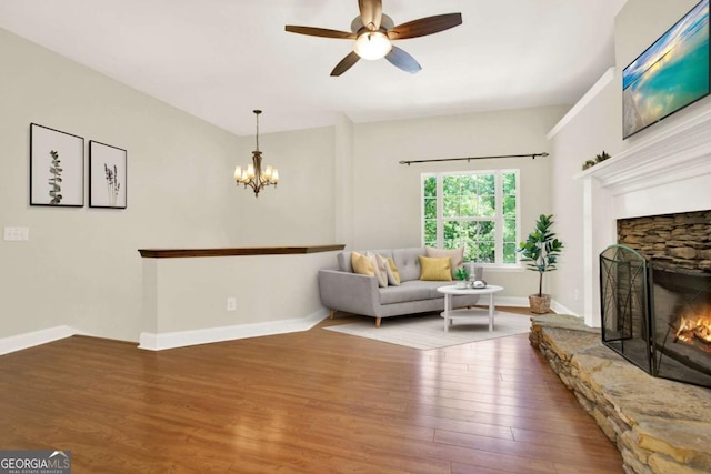 405 Scenic View Dr, Jasper, GA 30143 - living room featuring ceiling fan, wood finished floors, a fireplace, and a chandelier