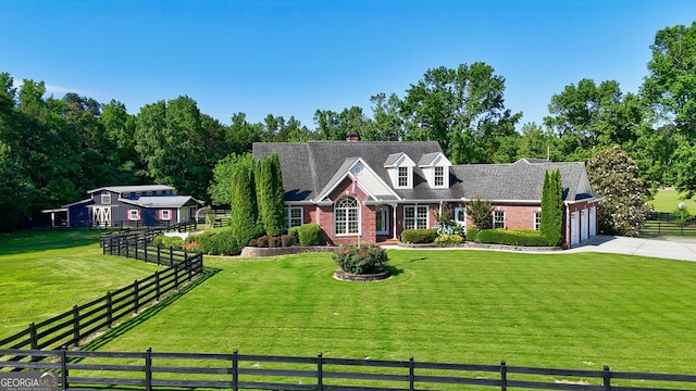 4320 Sandy Creek Rd, Madison, GA 30650 - cape cod-style house with concrete driveway, brick siding, and an attached garage