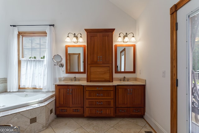 4320 Sandy Creek Rd, Madison, GA 30650 - full bath featuring tile patterned floors, double vanity, a bath, vaulted ceiling, and baseboards