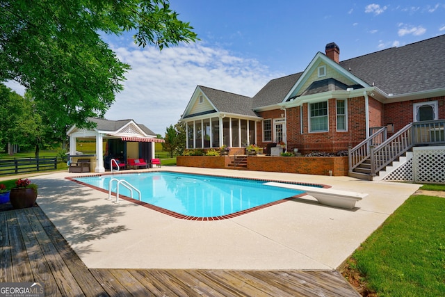 4320 Sandy Creek Rd, Madison, GA 30650 - view of pool with a sunroom, a wooden deck, a patio, and an outdoor structure