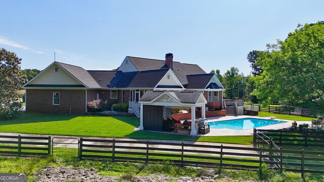 4320 Sandy Creek Rd, Madison, GA 30650 - back of house featuring brick siding and a chimney