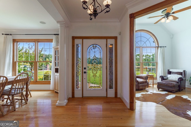 4320 Sandy Creek Rd, Madison, GA 30650 - entryway featuring light wood finished floors, decorative columns, healthy amount of natural light, a chandelier, and crown molding