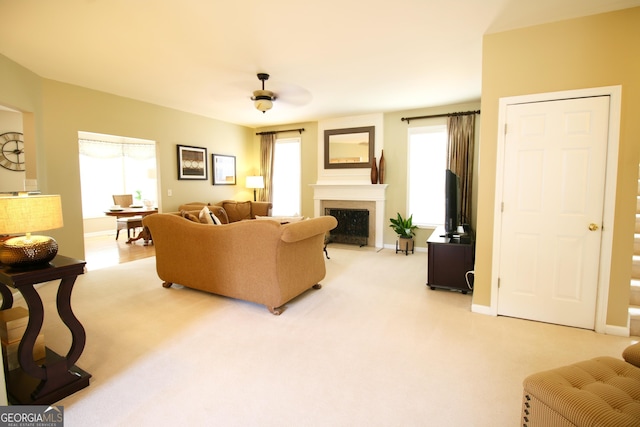 318 Ivy Manor Dr, Marietta, GA 30064 - living room featuring healthy amount of natural light, a fireplace with flush hearth, baseboards, and light carpet