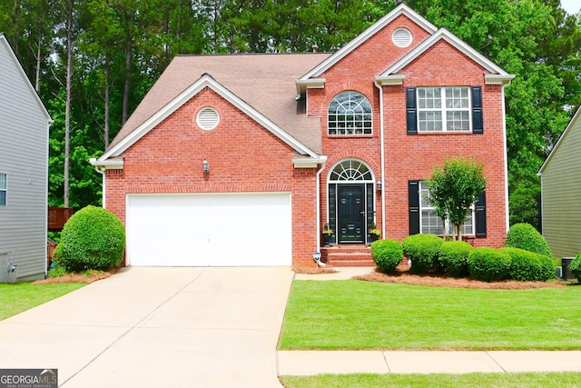 318 Ivy Manor Dr, Marietta, GA 30064 - view of front facade featuring brick siding, concrete driveway, a front lawn, and an attached garage
